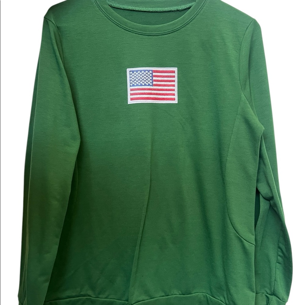 Green long sleeve “Freedom” logo.